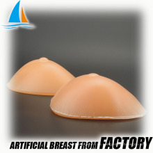 Tetas artificiales íntimas de silicona de grado médico.